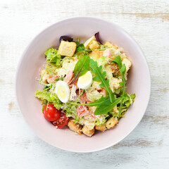 Caesar salad with chicken. Vegetable salad. Top view. Free space for your text.