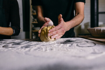 Baker making bread in bakery
