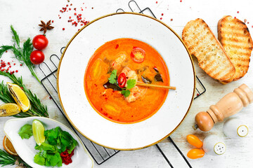 Tomato soup with seafood: shrimp and mussels. Top view. Free space for text.