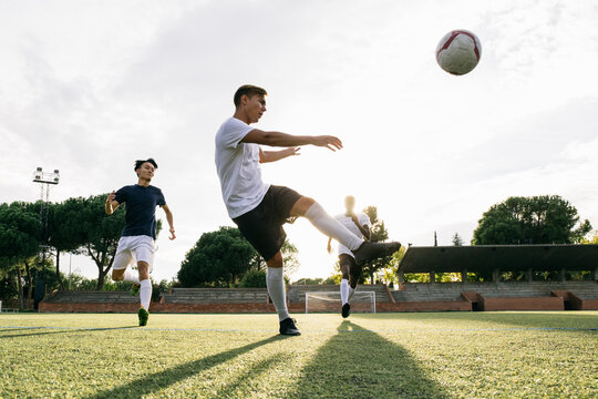 Fototapeta Men playing soccer