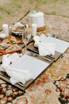 Picnic on the ground with carpet and vows