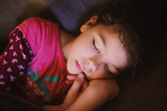 Night portrait of a sleeping young girl