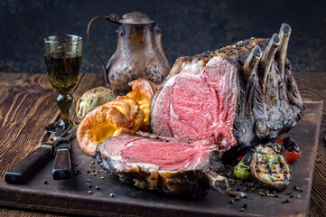 Traditional barbecue dry aged angus cote de boeuf with Yorkshire pudding and vegetable offered as...