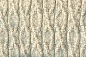 Pure milk-colored wool, bound with a three-dimensional pattern. Hand knitting, hobby. Warm, winter sweater, tied with a pattern of braids.