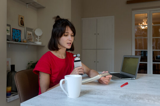 Podcast streaming young woman work from home