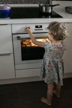 Little girl baking cookies