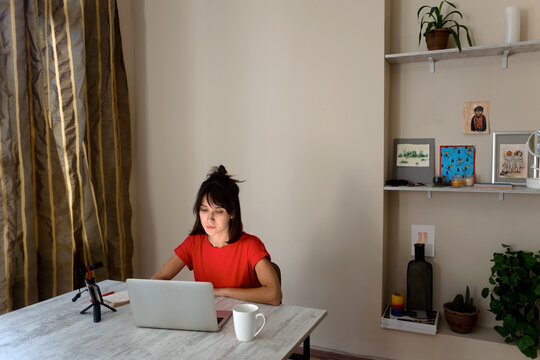 Podcast streaming young woman work from home
