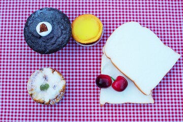 Bread slices cupcake dessert on red tablecloth