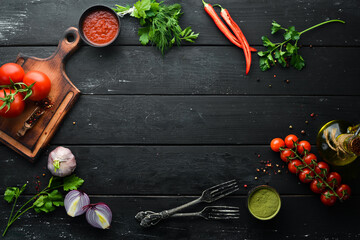 Black banner. Background of cooking, spices and vegetables. Top view. Free space for your text.