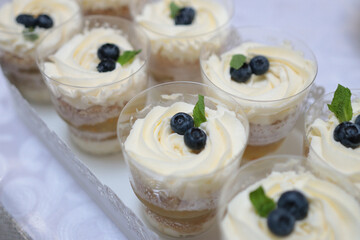 Serving a sweet table with a creamy dessert with a fruit accent