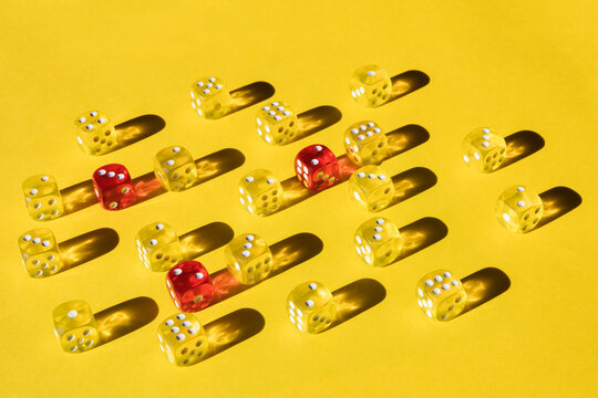 Yellow and red dice on yellow paper