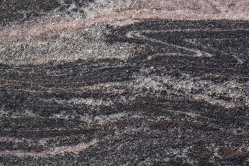 Granite stone texture closeup. Top view, background