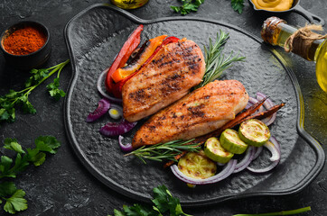 Baked chicken breast with spices and rosemary. Top view. BBQ.