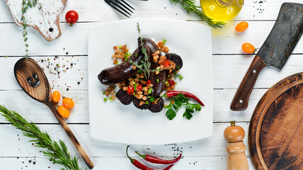 Sausage with buckwheat and blood. Restaurant dishes. Top view. Free copy space.