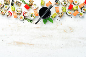 Set of sushi and soy sauce. Japanese Traditional Cuisine. Top view. Rustic style.