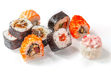 assorted japanese rolls on a light glass surface close up