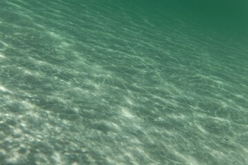 Fototapeta na wymiar Underwater photo of light textures