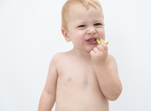 Baby Boy Trying And Tasting New Food. Dieting, Vegetarian And Healthy Nutrition Concept.