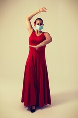 woman dancing flamenco sevillanas with mask