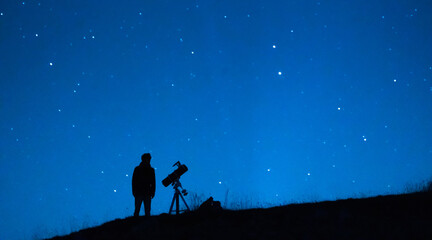 Obraz na płótnie Canvas Astronomer observing the immensity of the universe and the stars. Silhouette of a astronomy lover person with a telescope observing the blue starry sky at night.