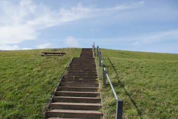 Stairs on Dutch dyke, seawall as protection against the North Sea (Hondsbossche Zeewering). Netherlands, September.