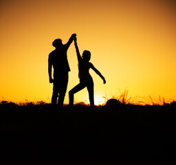 Couple dancing salsa at sunset. Love couple. Dance. Sunset. Lovely. 
