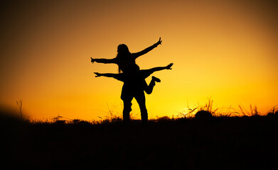 Fototapeta na wymiar silhouettes in love romantic couple lovers hugging. Couple in love. Sensual. Happy day. Sunset. Photo. Background. 