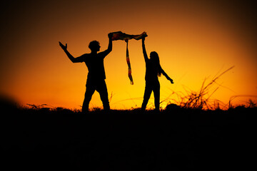 silhouette lovers couple. Couple in love. Sensual. Fun. Summer day. Life. 