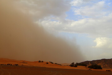 Fototapeta premium A sand storm over the Merzouga desert, Morocco