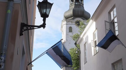 The flag outside the buildings in Tallinn Old Town in Estonia.4K