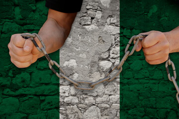 male hands break the iron chain, a symbol of bondage,protest against the background of the national...