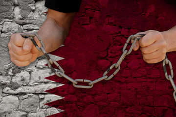 male hands breaking the iron chain, symbol of bondage, protest against the background of the state...