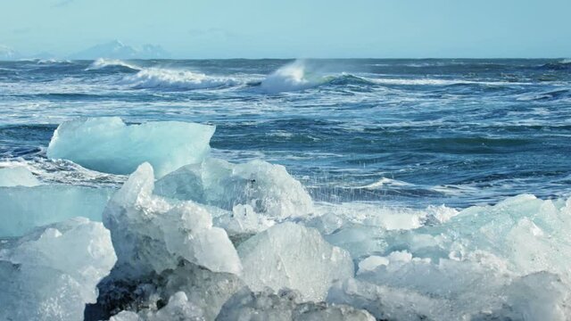 Wide, waves crash on Okulsarlon Beach during winter