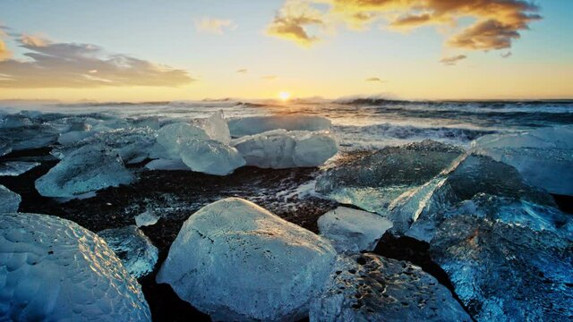 Iceberg On Iceland Beach At Sunset, Slow Motion Close Up