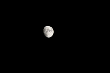 Bright moon during a dark, almost full night, with copy space.