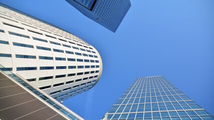Obraz na płótnie Canvas Bottom view of modern office buildings in the business district