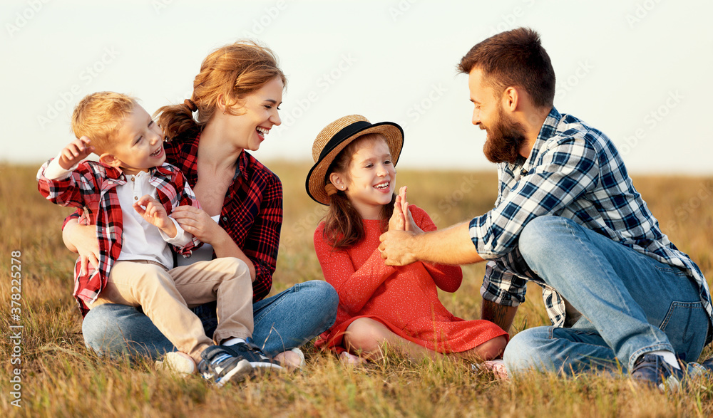 Canvas Prints happy family: mother, father, children son and daughter on sunset.