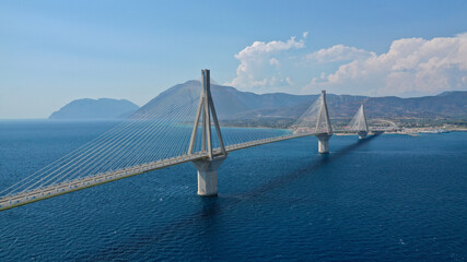 Aerial bird's eye drone photo of state of the art suspension bridge crossing the sea