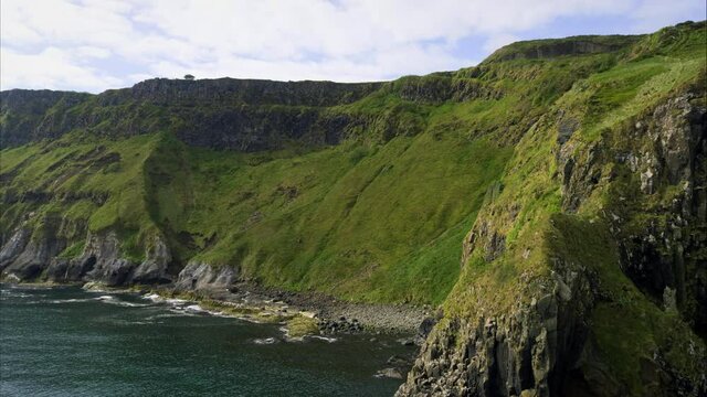 Panning aerial, steep coastal cliffs in Ireland