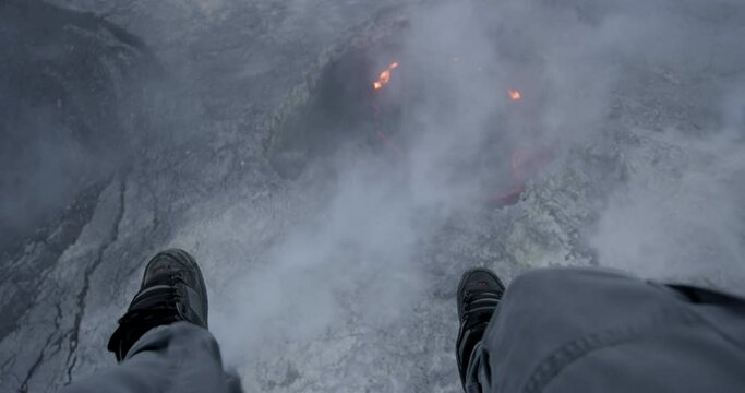 Pov aerial, person parachutes over active volcano