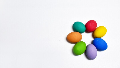 Variety of colorful Easter eggs on white background, selective focus