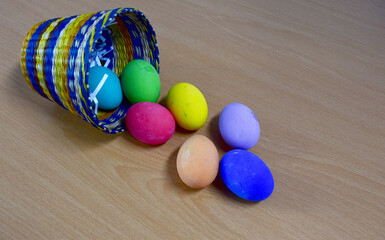 Easter eggs in the Basket on Wooden Table at morning day.
