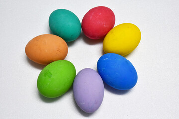Variety of colorful Easter eggs on white background, selective focus