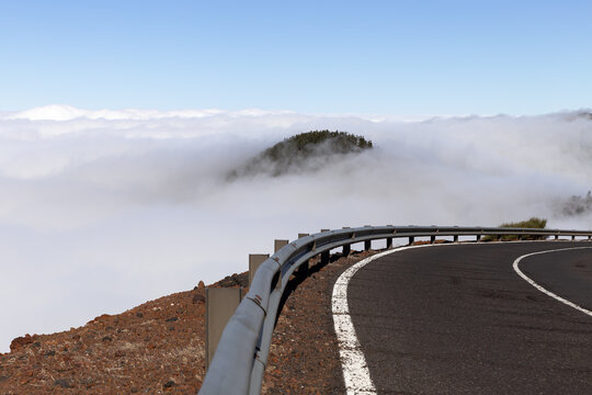 Winding mountain road above the clouds on the island of Tenerife
