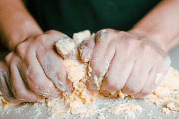 person kneading dough