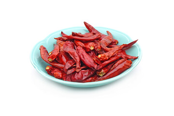 Dried red hot chili peppers in ceramic dish isolated on white background