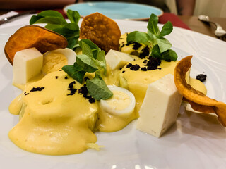 Huancahina style potato. Starter of the Peruvian Creole food with potato, huancahina sauce and sweet potato.
