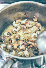 Boiled snails in casserole. Mediterranean food from the island of Majorca.