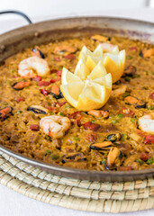 Seafood paella with lemon. Food of the Mediterranean, of the island of Majorca.