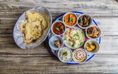Fried dough, beans, sauces and tortillas. Indian food.